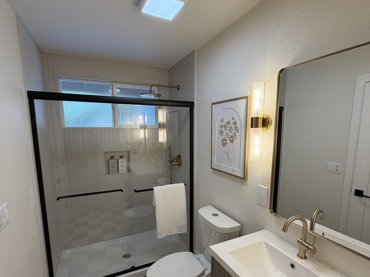 Bathroom remodel with a walk-in shower and checkerboard floor