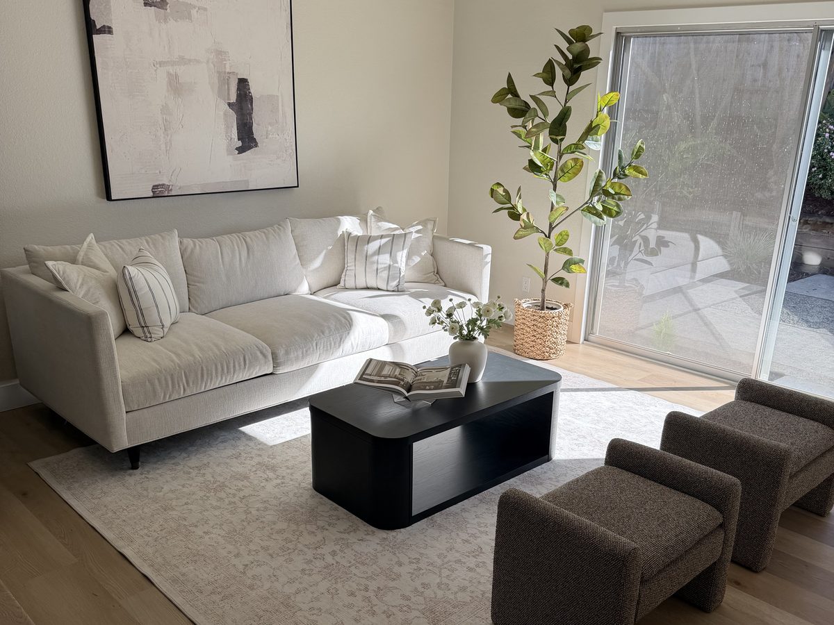 Living area after a whole-house remodel, with new flooring throughout